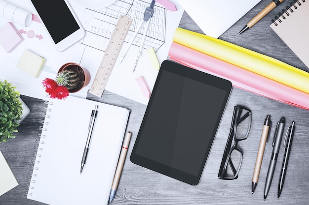 Planning workspace with notebooks and digital tools